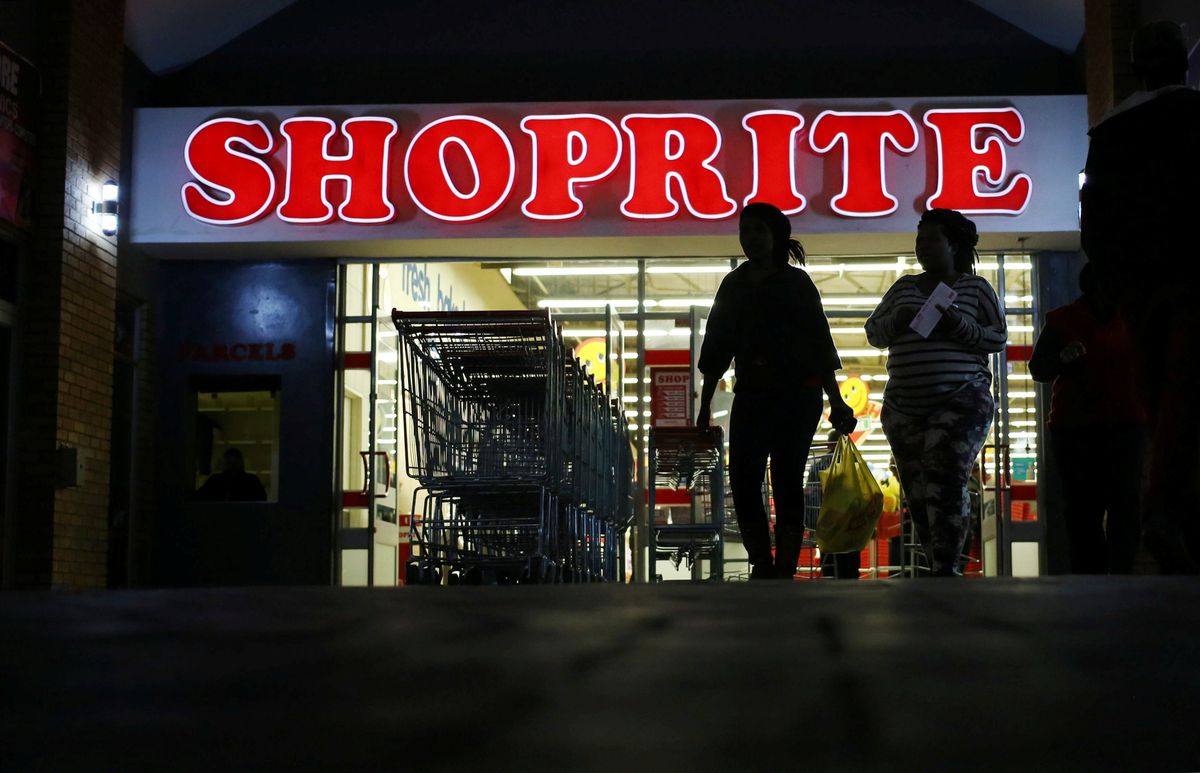 ​Shoppers leave the Shoprite store in Daveyton, South Africa May 23, 2018. 