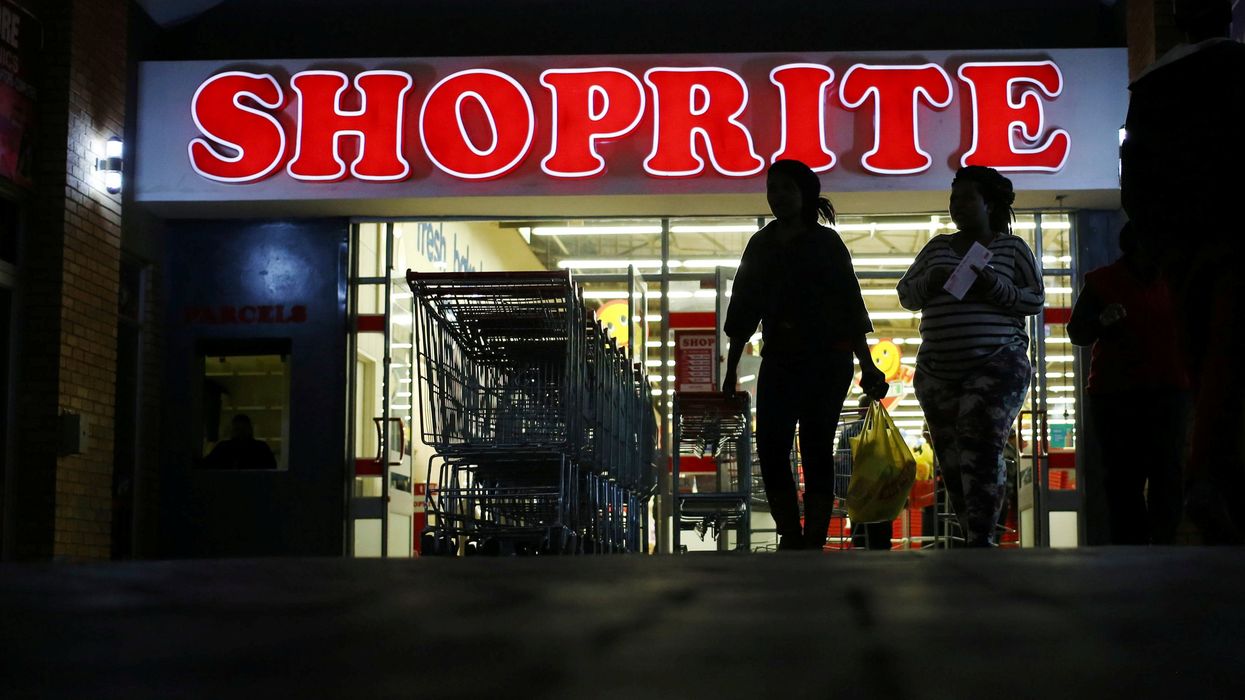 Shoppers leave the Shoprite store in Daveyton, South Africa May 23, 2018.