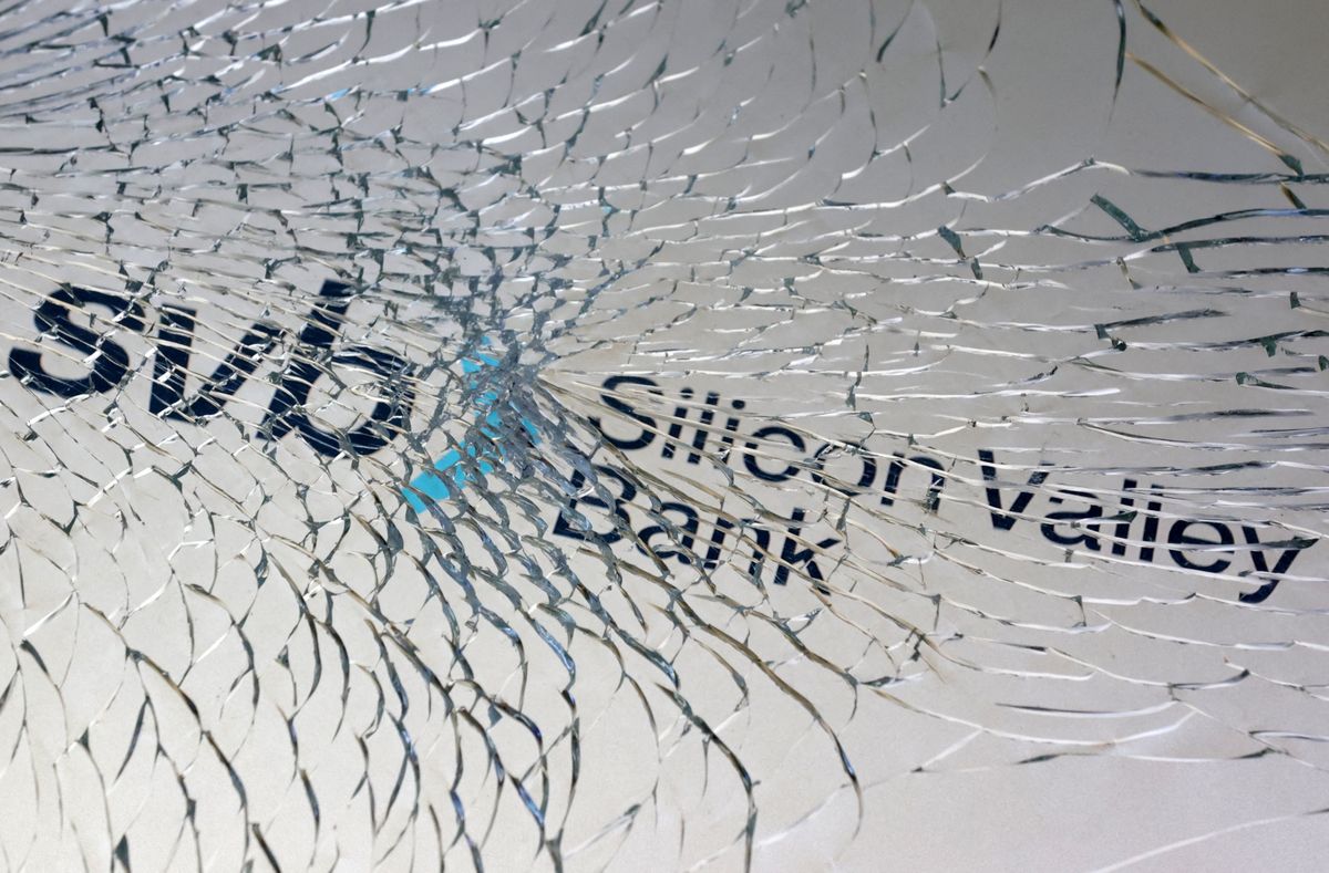Silicon Valley Bank logo seen through broken glass.
