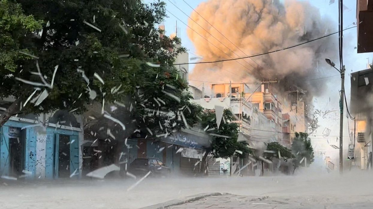 Smoke rises following an Israeli strike on a residential building, amid the ongoing conflict between Israel and Hamas, Nuseirat in the central Gaza Strip, in this screen grab taken from a video, August 18, 2024.