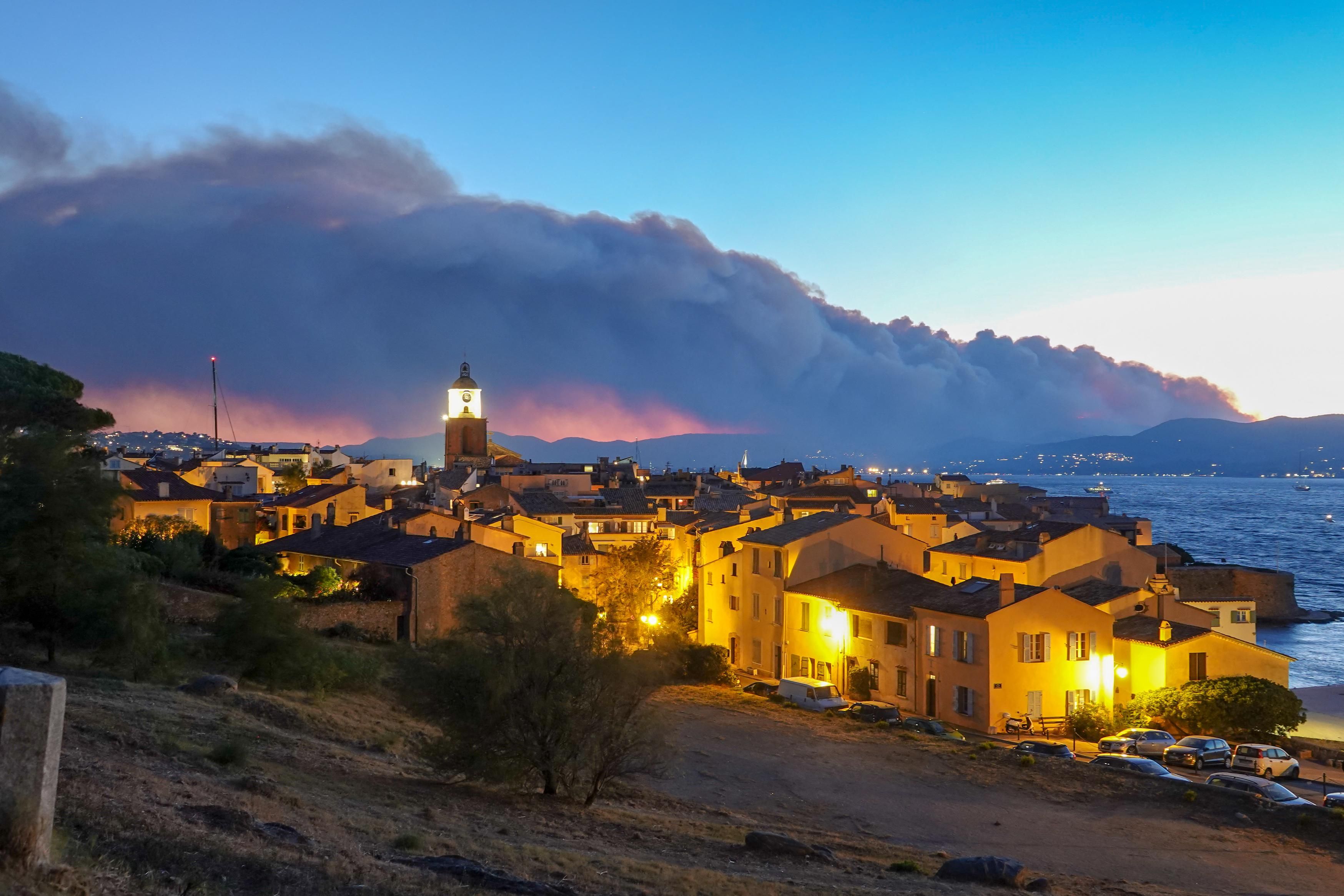 Smoke rises from a massive wildfire in Gonfaron, seen from the heighys of Saint Tropez, south of France on August 16, 2021. 