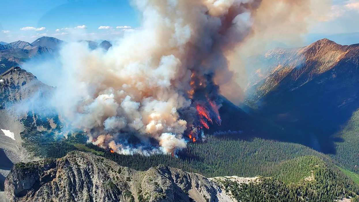 Smoke rises from the Texas Creek wildfire south of Lillooet, British Columbia.