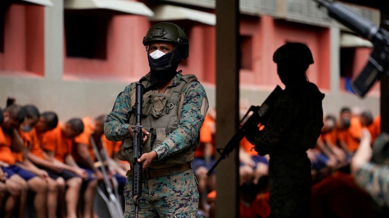 Soldiers keep watch in the militarized Litoral prison, part of the measures taken by Ecuador's President Daniel Noboa to crackdown on gangs, during a media tour in Guayaquil, Ecuador, Feb. 9, 2024.