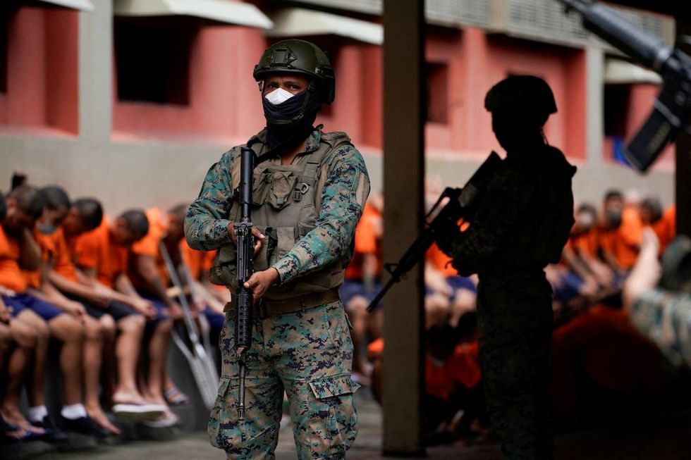 Soldiers keep watch in the militarized Litoral prison, part of the measures taken by Ecuador's President Daniel Noboa to crackdown on gangs, during a media tour in Guayaquil, Ecuador, Feb. 9, 2024. 
