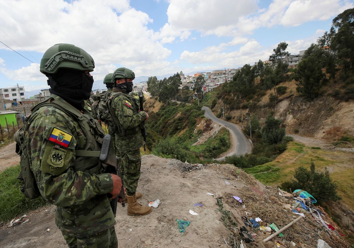Soldiers patrol an area next a road prior to Sunday's presidential election, in Quito, Ecuador.