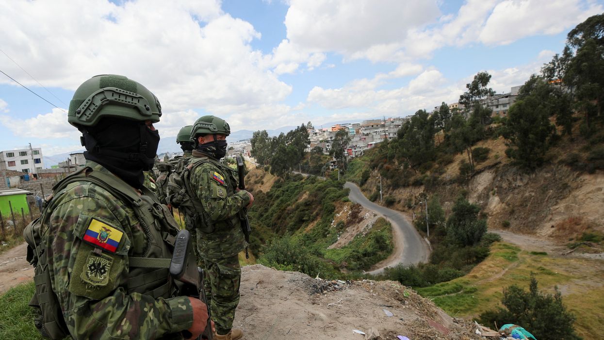 Soldiers patrol an area next a road prior to Sunday's presidential election, in Quito, Ecuador.