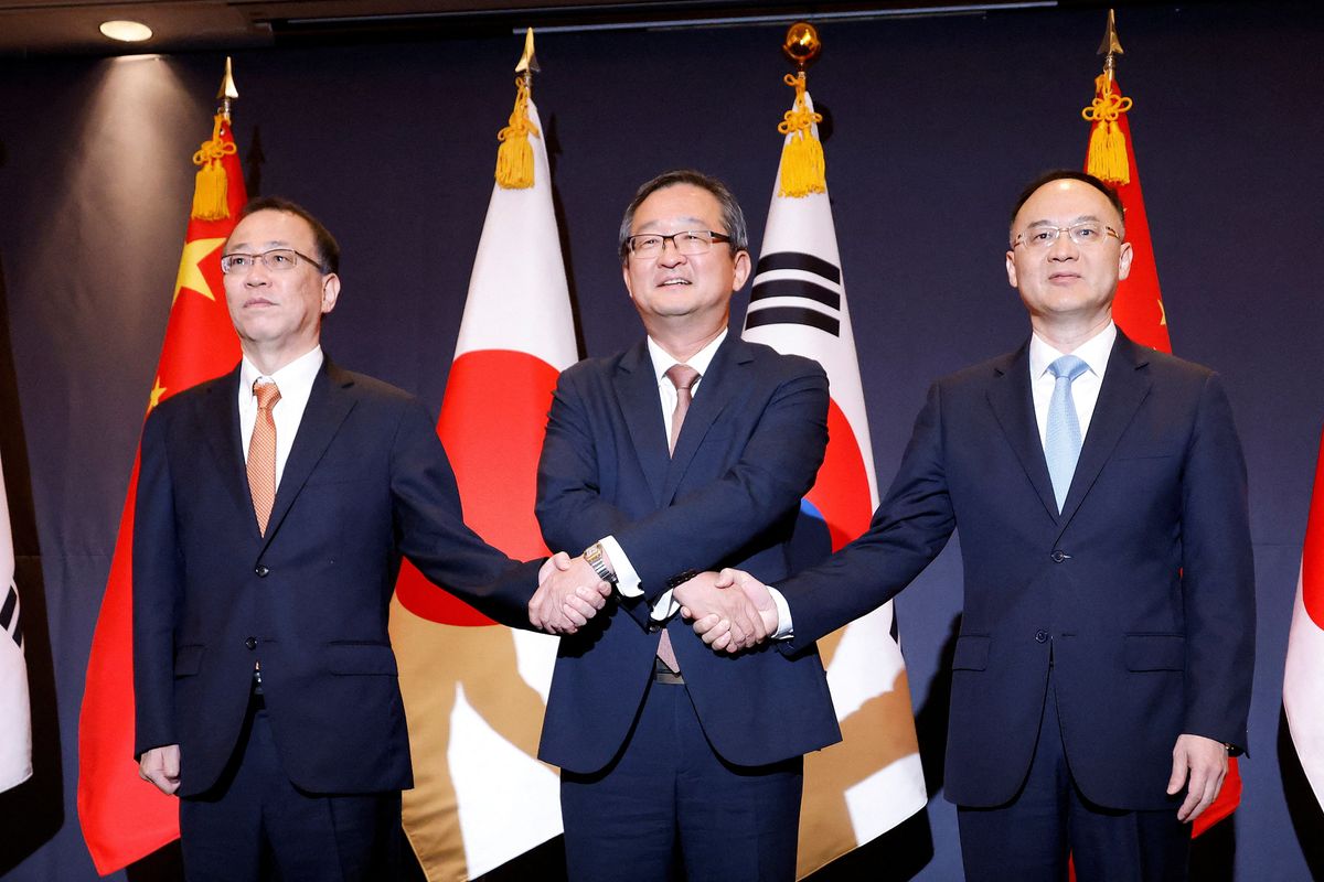South Korea's deputy foreign minister for political affairs, Chung Byung-won, Japan's Senior Deputy Minister for Foreign Affairs, Takehiro Funakoshi, and China's Assistant Foreign Minister, Nong Rong, pose for photographs during their meeting in Seoul, South Korea, September 26, 2023.