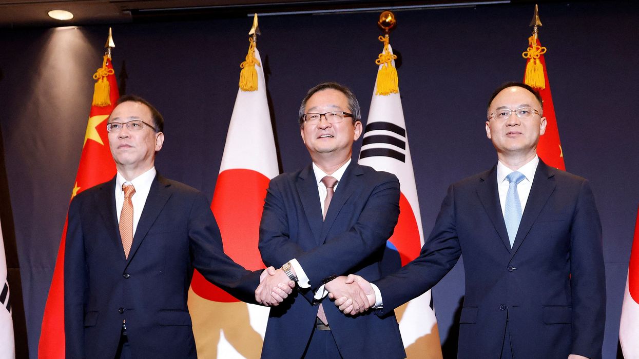 South Korea's deputy foreign minister for political affairs, Chung Byung-won, Japan's Senior Deputy Minister for Foreign Affairs, Takehiro Funakoshi, and China's Assistant Foreign Minister, Nong Rong, pose for photographs during their meeting in Seoul, South Korea, September 26, 2023.