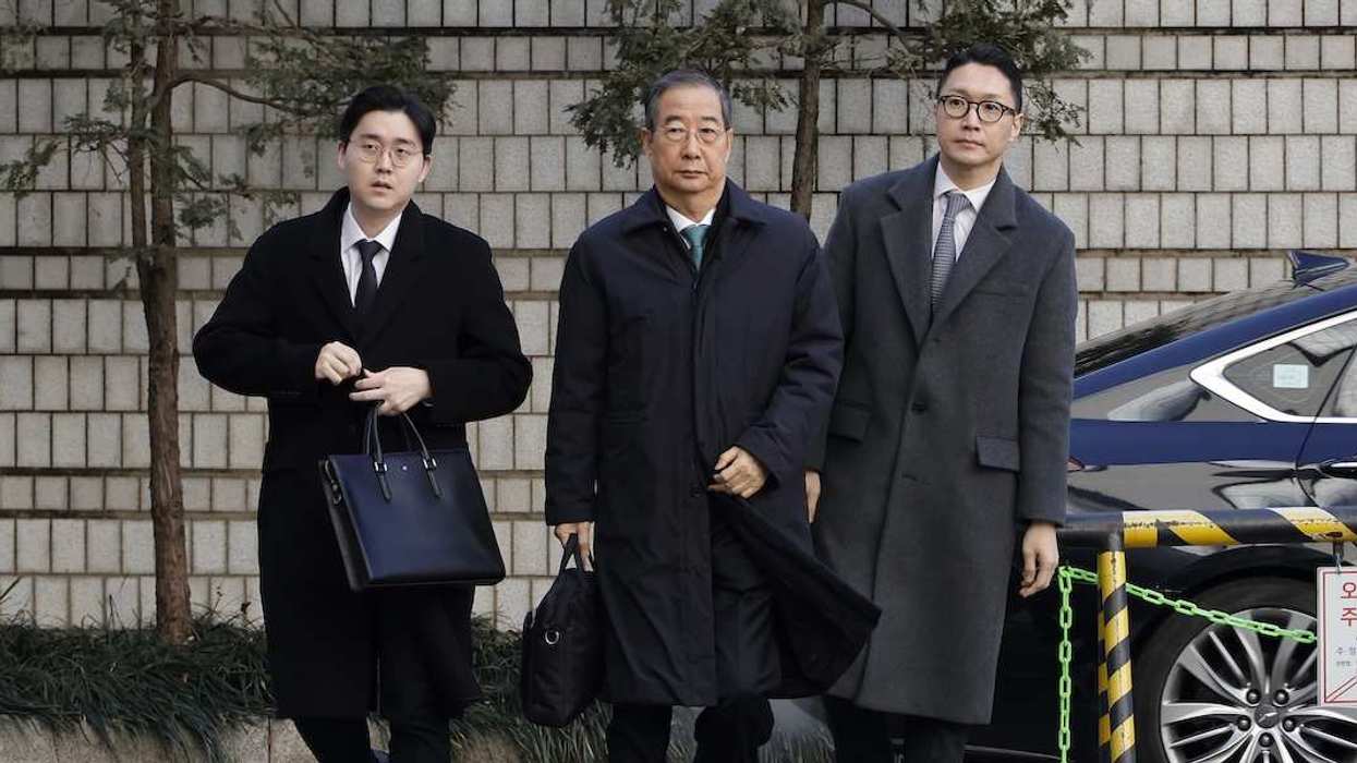 South Korea's former prime minister Han Duck-soo arrives at Seoul Central District Court to receive a first-instance verdict on insurrection-related charges, in Seoul, South Korea on January 21, 2026.