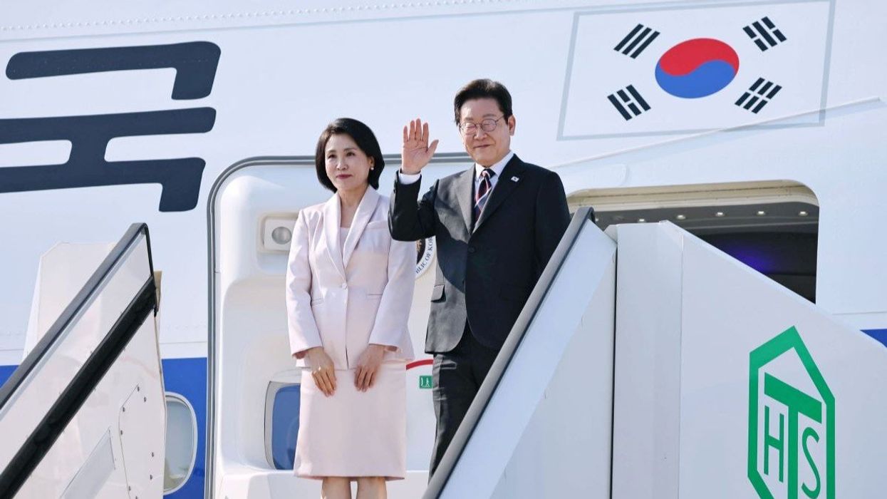 South Korean President Lee Jae Myung and his wife, Kim Hye Kyung, at Tokyo's Haneda airport on Aug. 24, 2025.