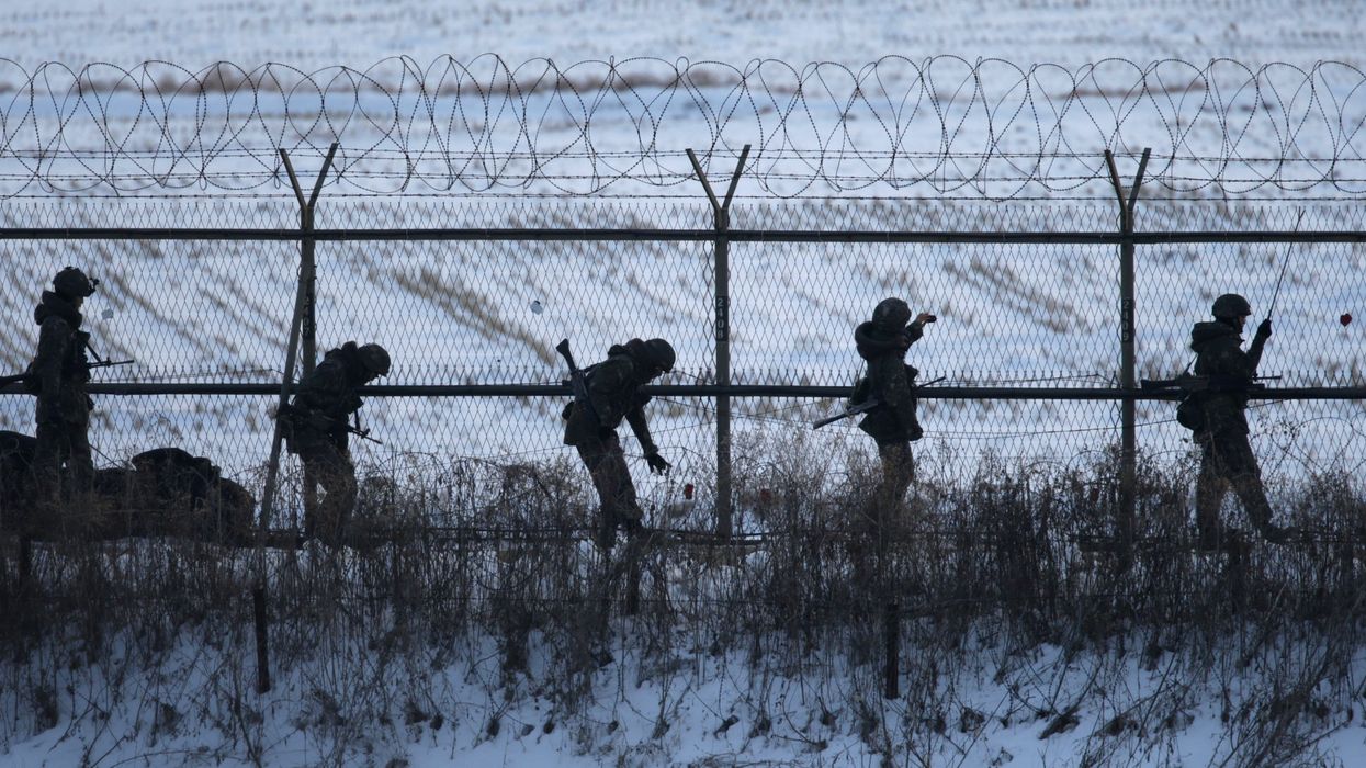South Korean soldiers check military fences as they patrol near the demilitarized zone separating North Korea from South Korea, in Paju, north of Seoul February 12, 2013.