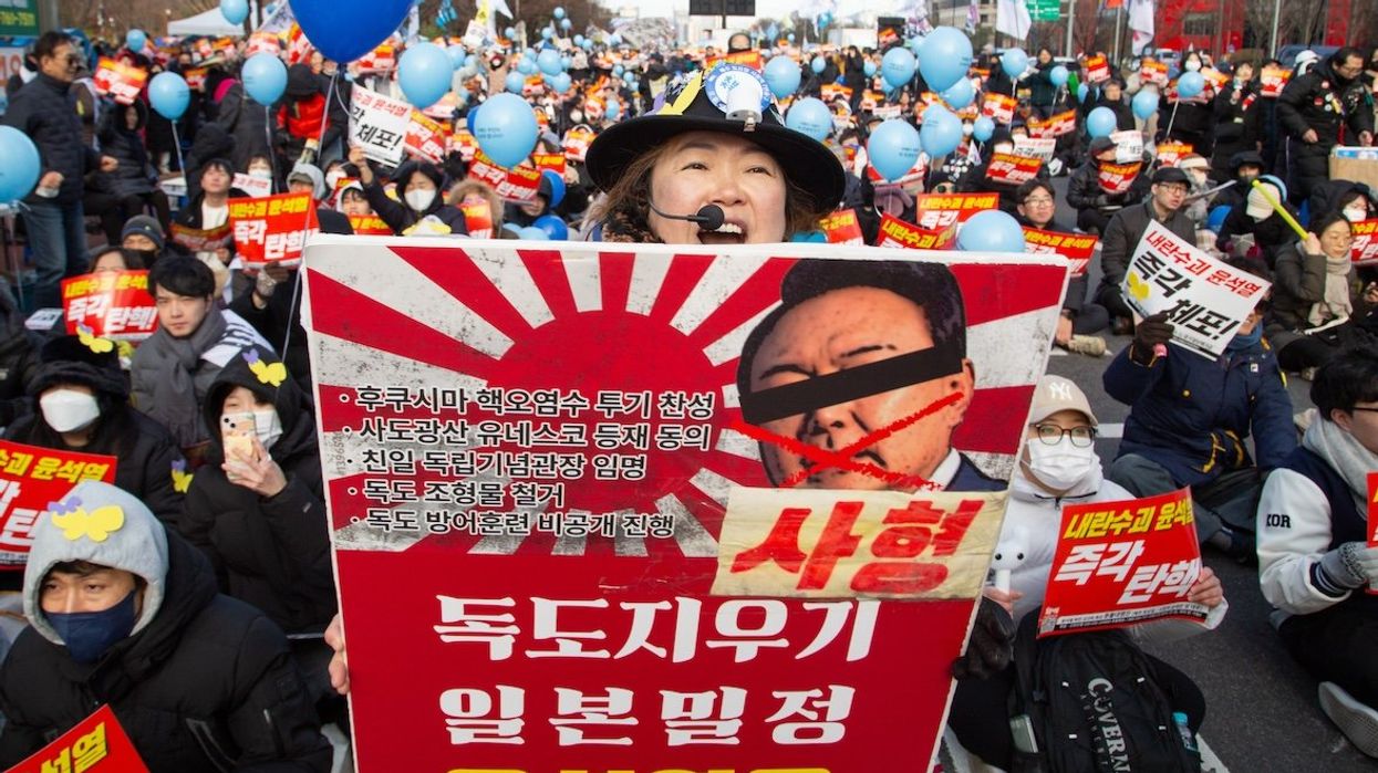 South Koreans hold a mass rally demanding the impeachment and imprisonment of President Yoon Suk-Yeol near the National Assembly in Seoul, South Korea, on Dec. 7.