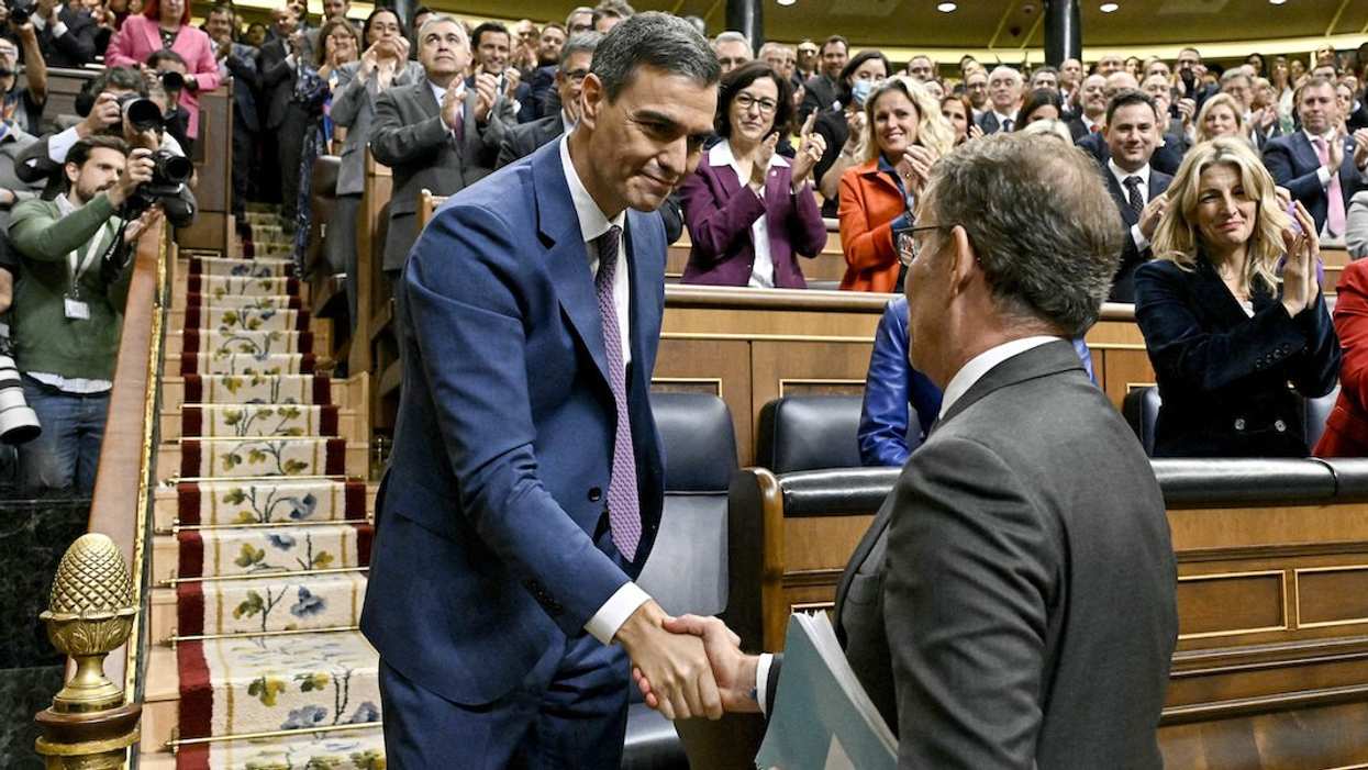 Spain's newly re-appointed Prime Minister Pedro Sanchez is congratulated by People's Party leader Alberto Nunez Feijoo, at the Spanish parliament in Madrid, Spain, November 16, 2023.