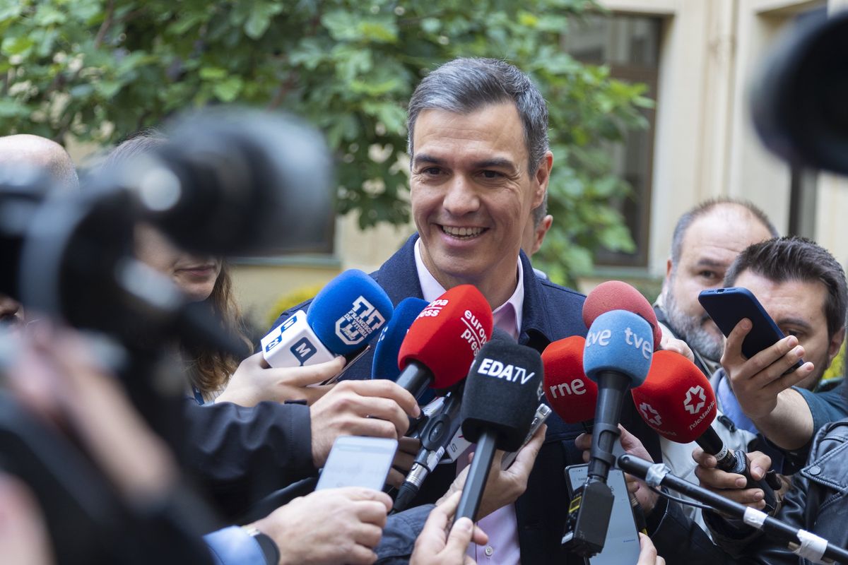 Spanish PM Pedro Sánchez addresses the media after casting his vote in the municipal and regional elections in Madrid.