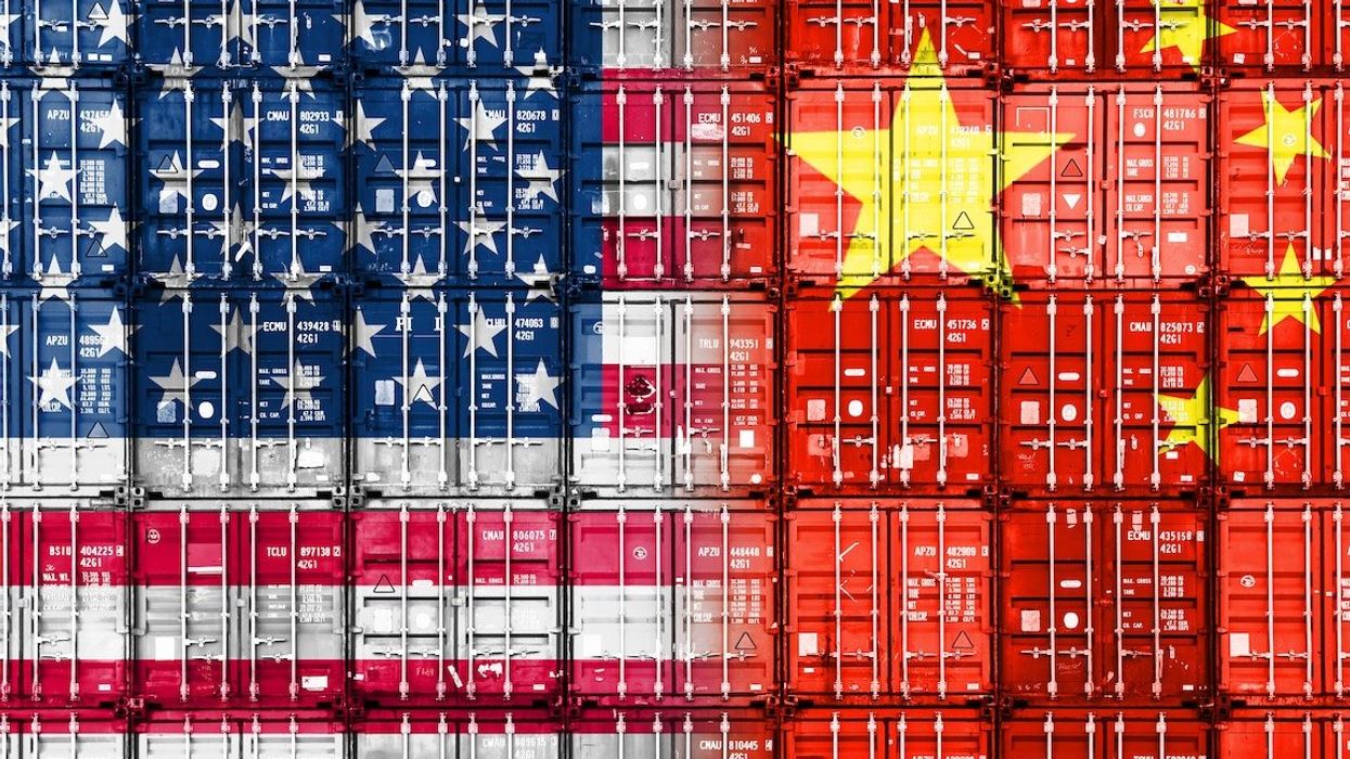 Stacked containers in American and Chinese national colors symbolize a trade war between the US and China.