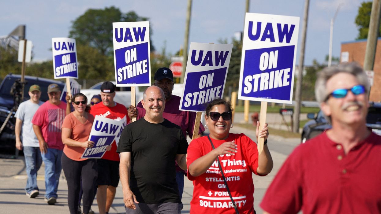 Striking UAW workers picket outside a Stellantis facility in Center Line, Michigan, on Sept. 22, 2023.