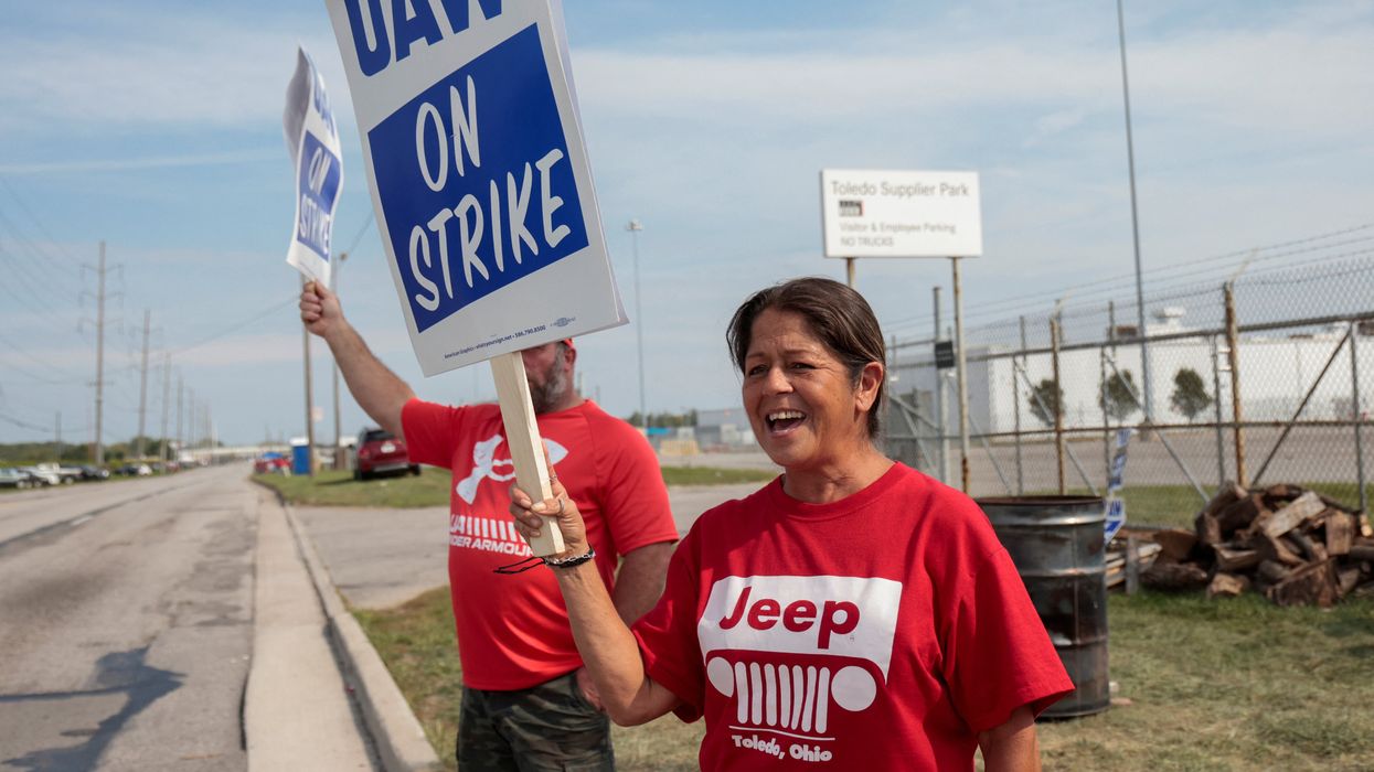 Striking United Auto Workers members picket outside the Stellantis Jeep Plant in Toledo, Ohio.