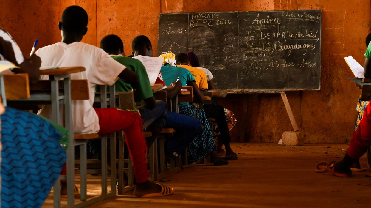 Students attend their final exam at the secondary school in Burkina Faso