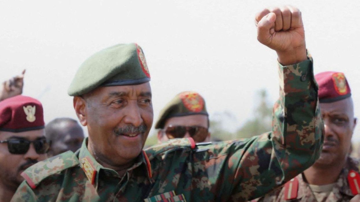 Sudan's army chief Abdel Fattah al-Burhan salutes soldiers at the presidential palace in Khartoum, Sudan, on March 26, 2025.