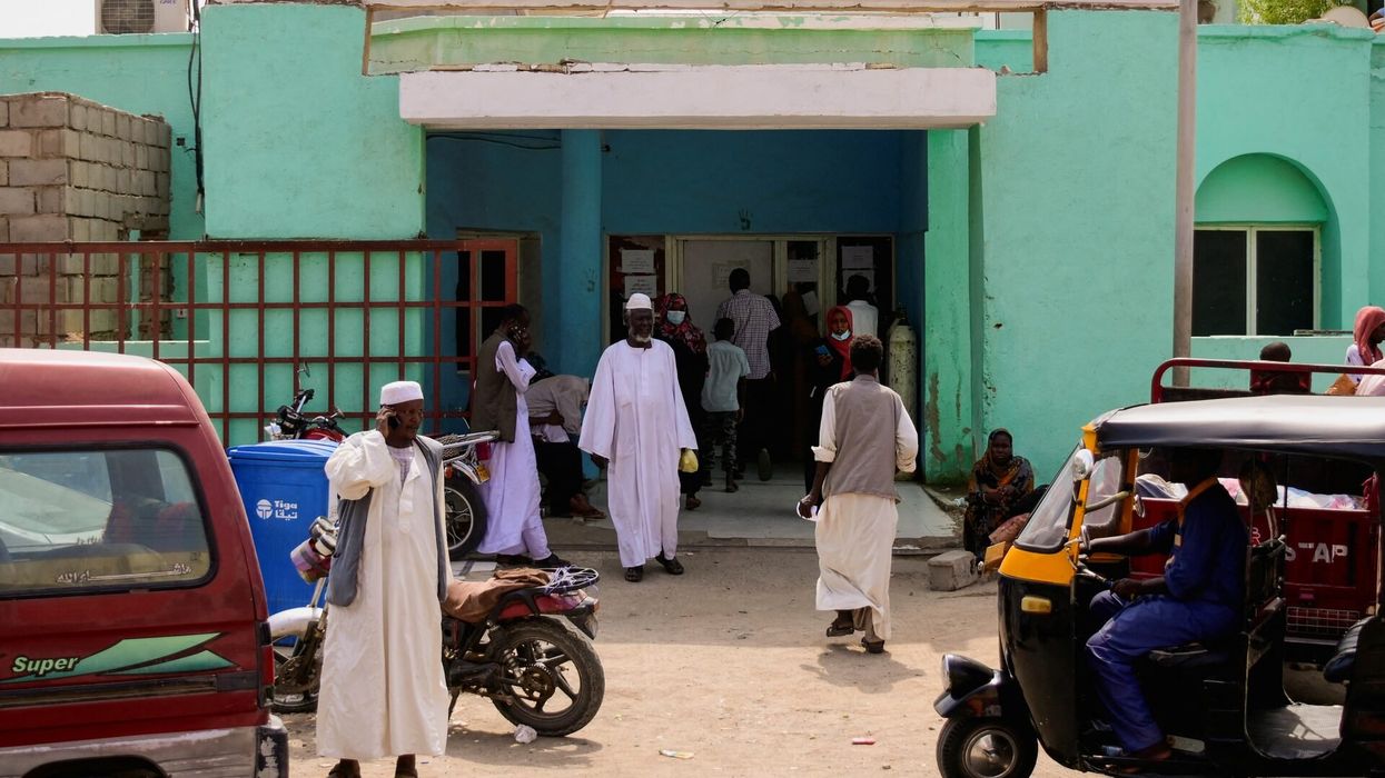 Sudanese families wait outside a hospital while doctors and medical staff strike to protest late salaries, bringing the struggling health sector in the city of Port Sudan to almost a complete halt as thousands of displaced Sudanese flooded the city due to the raging war in Khartoum, Sudan, August 20, 2023.