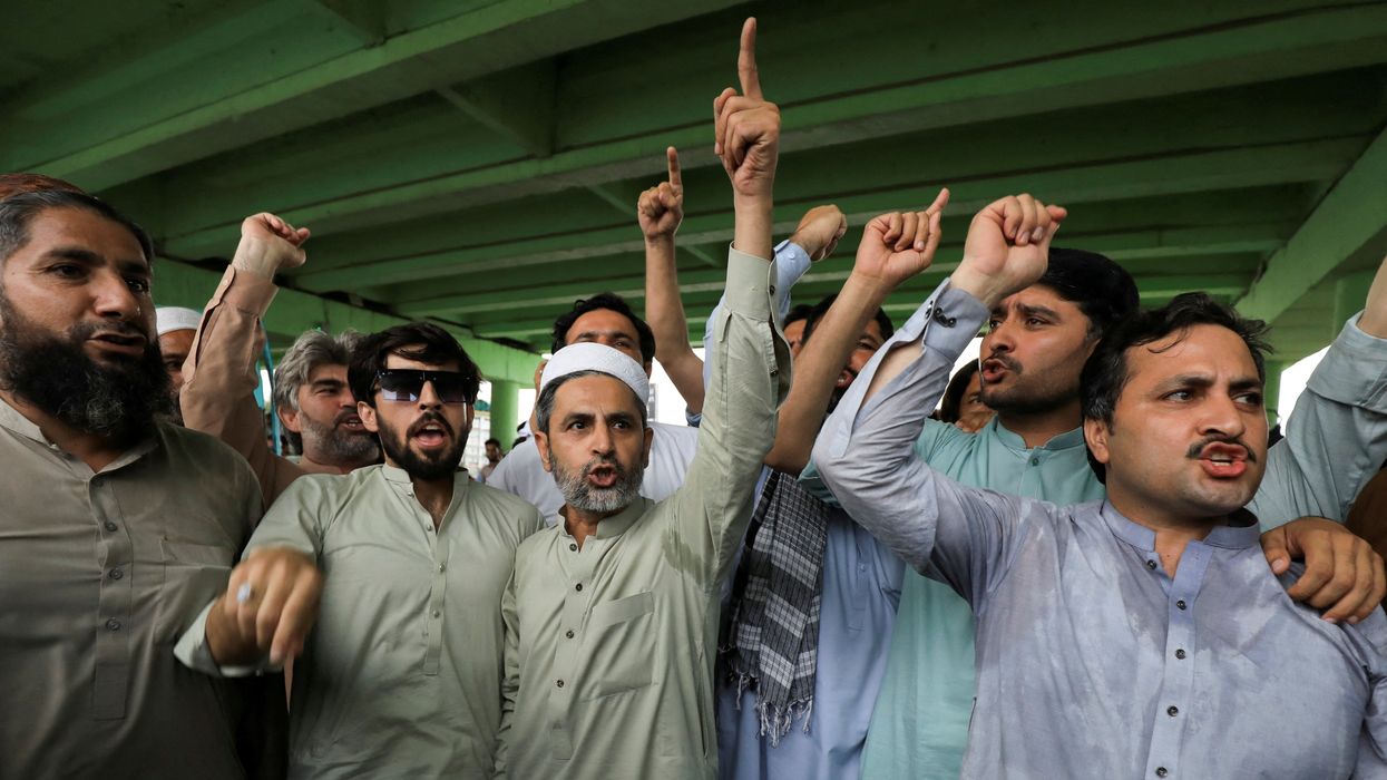 Supporters chant slogans as they gather for a protest following the arrest of Pakistan's former Prime Minister Imran Khan, in Peshawar, Pakistan.