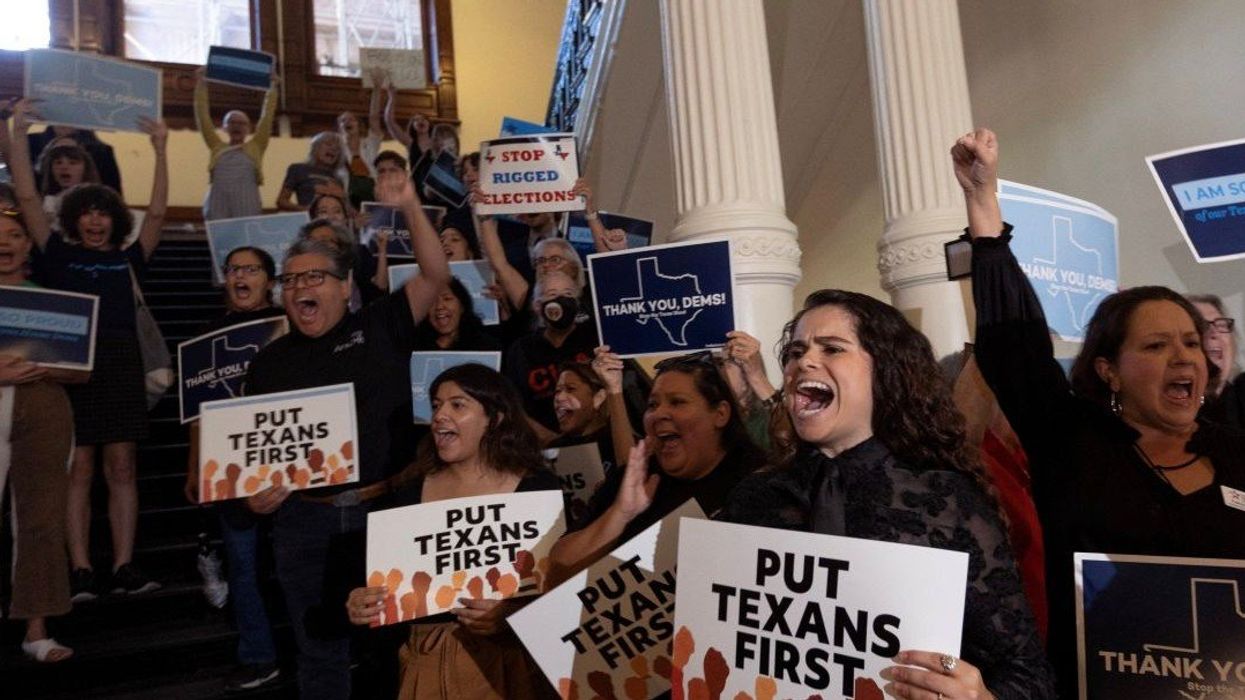 Supporters greet the Democratic lawmakers who left the state to deny Republicans quorum, as they return to the House, as the attempt to redraw the state's 38 congressional districts continues, at the Texas State Capitol, in Austin, Texas, U.S. August 18, 2025.