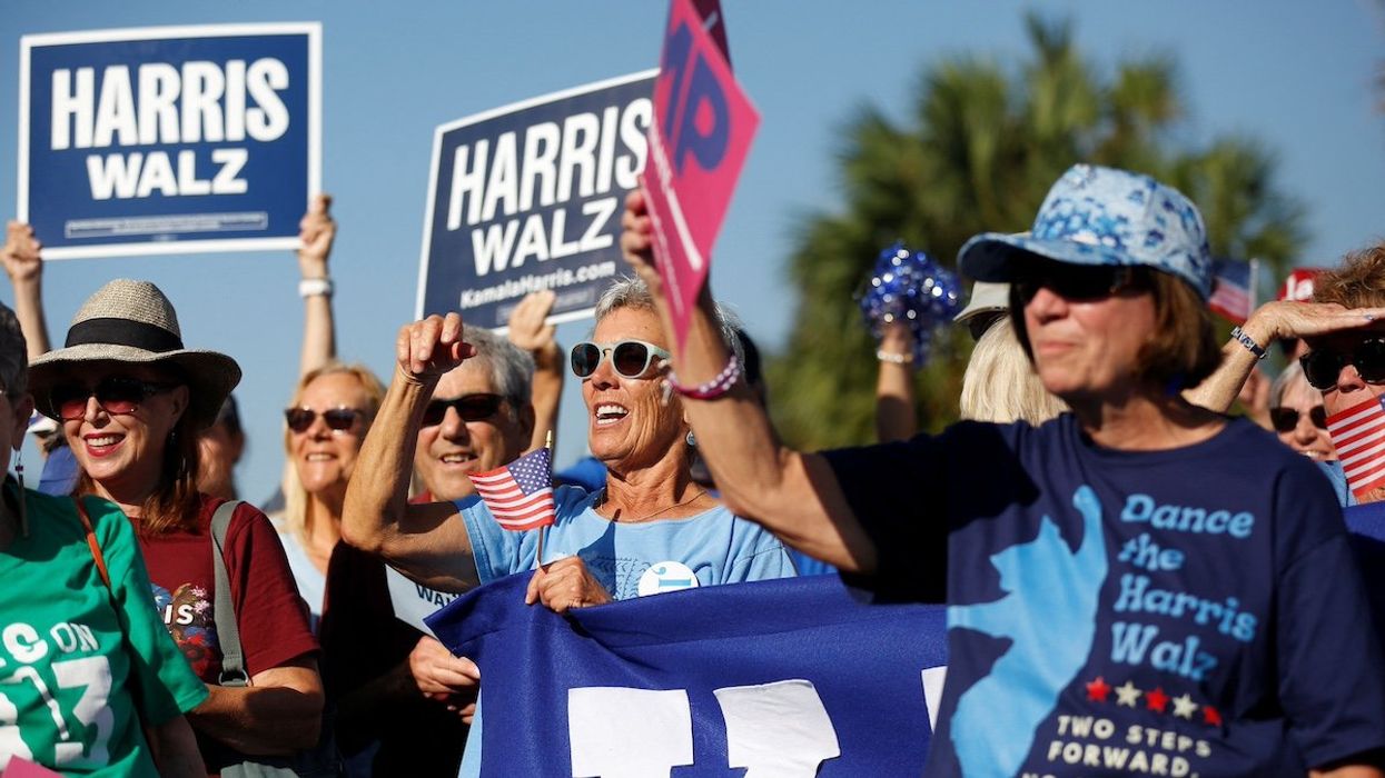 Supporters of Democratic presidential nominee and U.S. Vice President Kamala Harris cheer before the start of the golf cart rally in the retirement community of The Villages, Florida U.S. October, 14, 2024.