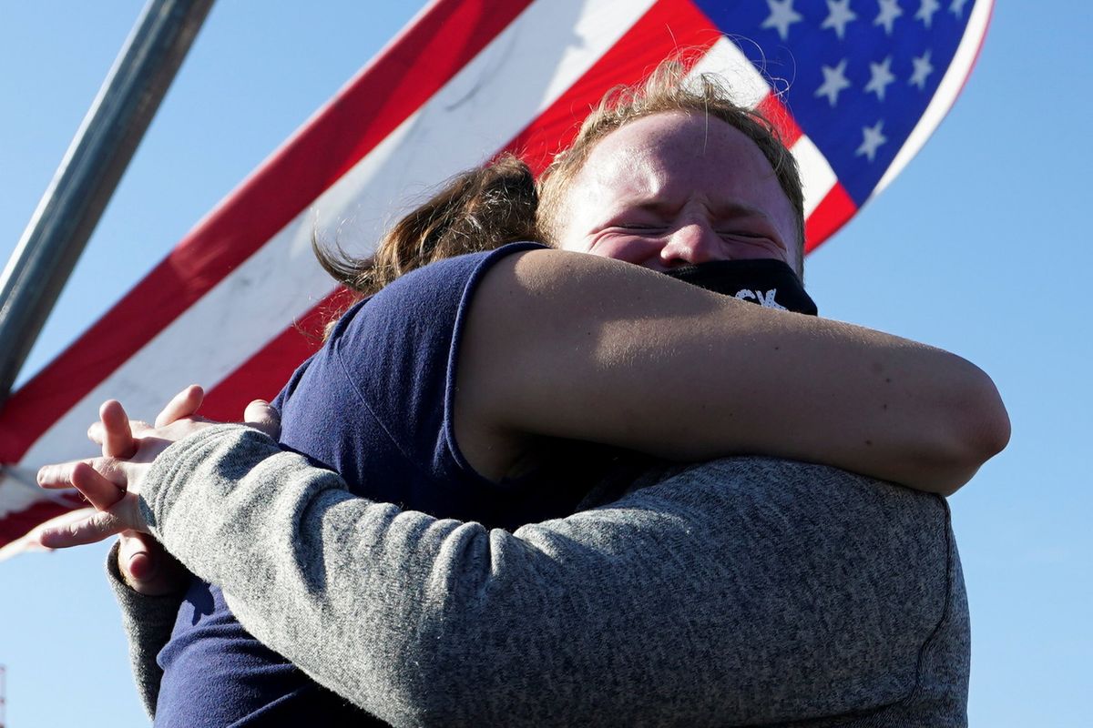 Supporters of Democratic U.S. presidential nominee Joe Biden embrace