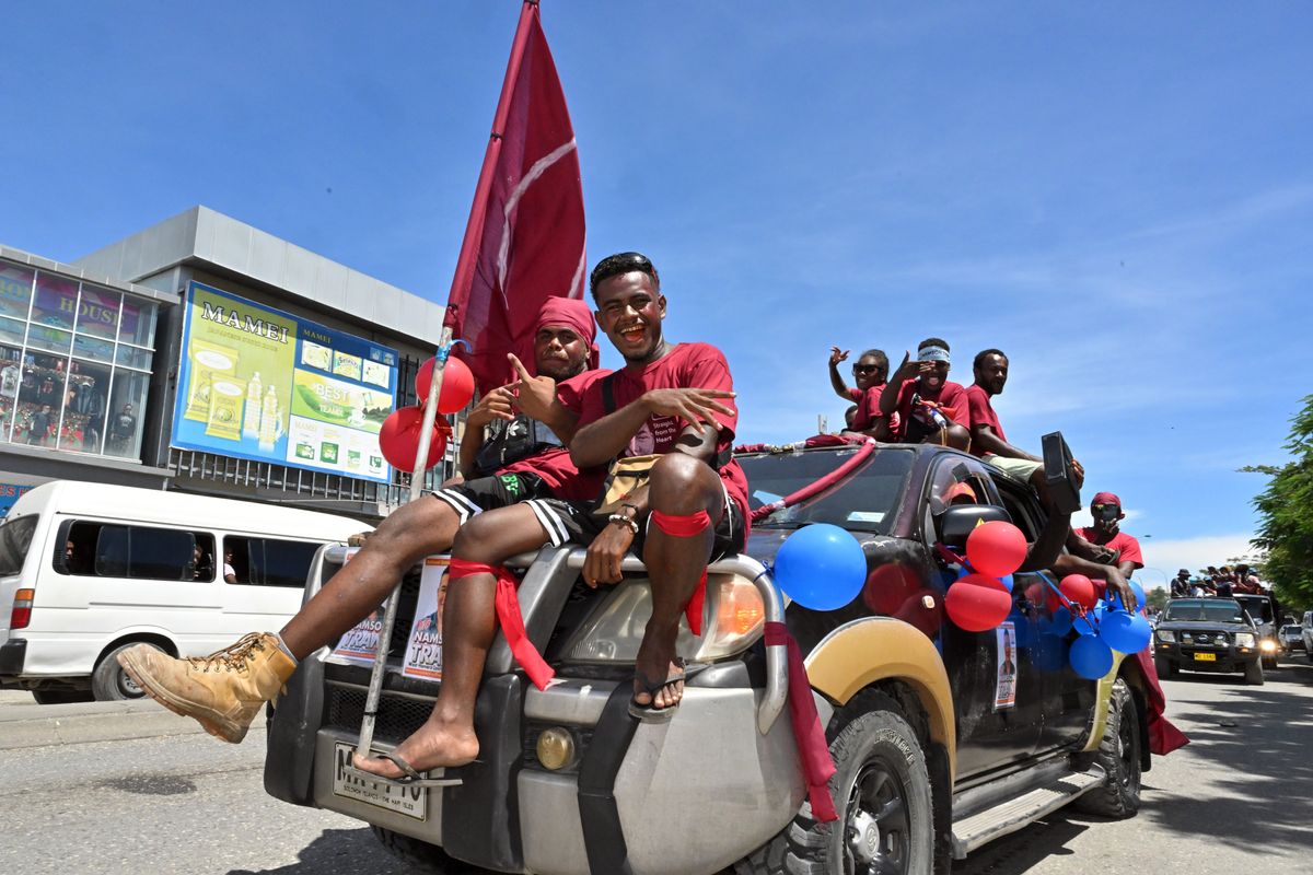 ​Supporters of former deputy speaker Namson Tran cheer and wave in the capital Honiara, Solomon Islands, Monday, April 15, 2024. Solomon Islanders are set to go to the polls on April 17