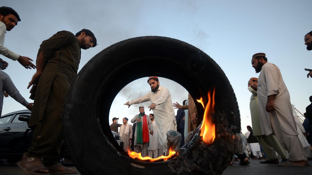 Supporters of former Pakistani PM Imran Khan's block a Peshawar motorway toll plaza after he was disqualified from holding public office.
