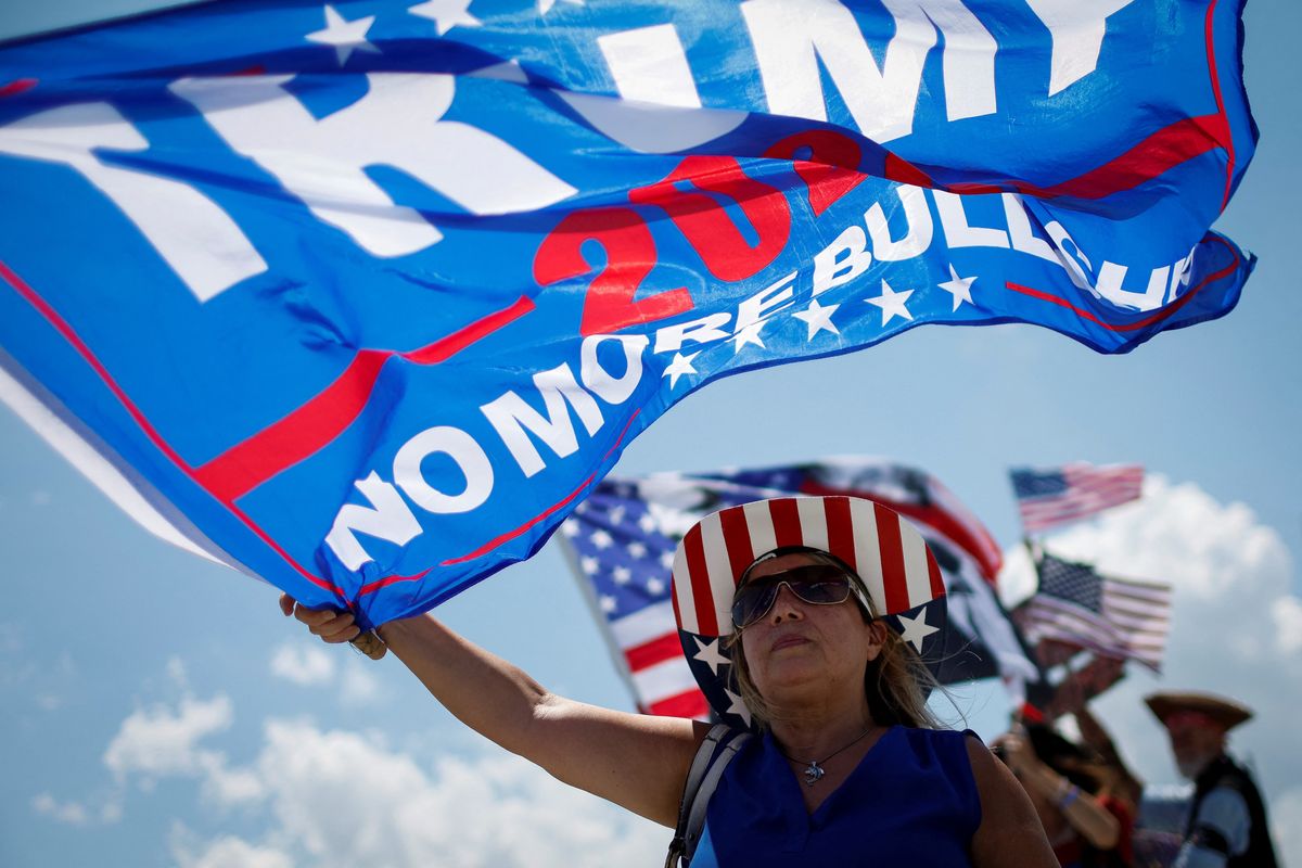 Supporters of former US President Trump gather outside his Mar-a-Lago resort in Palm Beach, Florida.