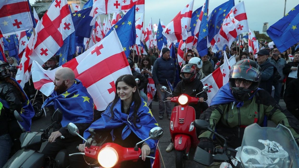 Supporters of Georgia’s pro-Western and pro-EU opposition groups hold a joint final campaign rally ahead of the upcoming parliamentary elections in Tbilisi, Georgia, on Oct. 20, 2024.