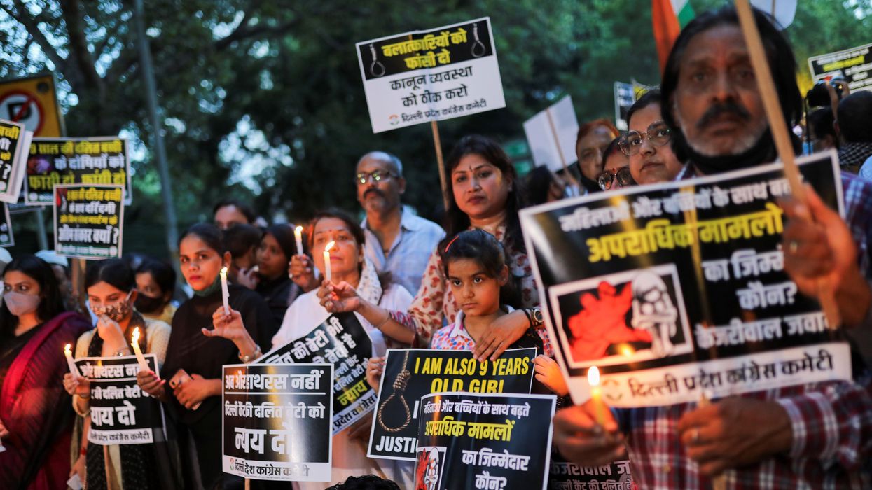 Supporters of India's main opposition Congress party attend a candlelight vigil to protest against the alleged rape and murder of a 9-year-old girl in New Delhi, India, August 4, 2021