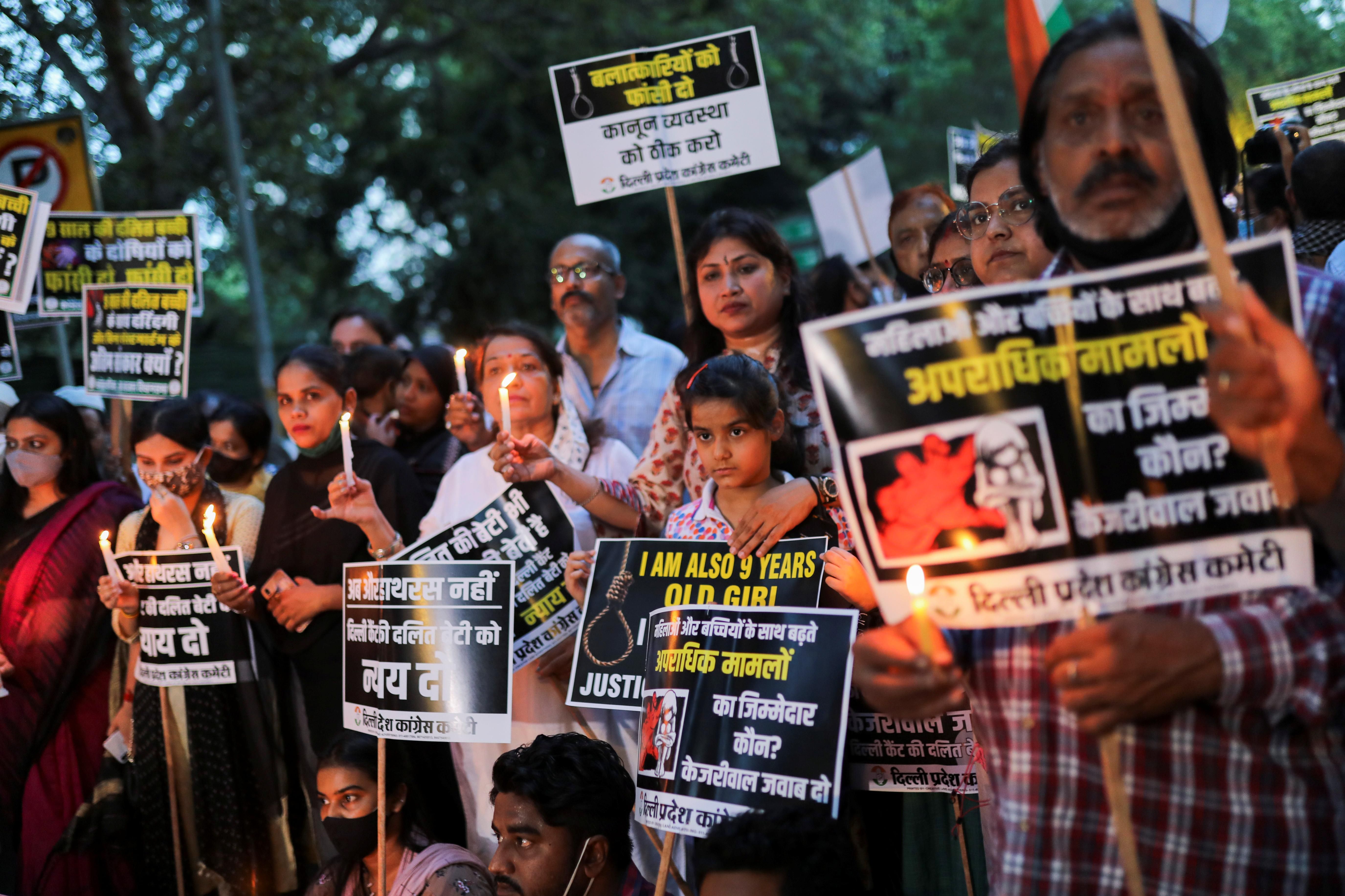 Supporters of India's main opposition Congress party attend a candlelight vigil to protest against the alleged rape and murder of a 9-year-old girl in New Delhi, India, August 4, 2021