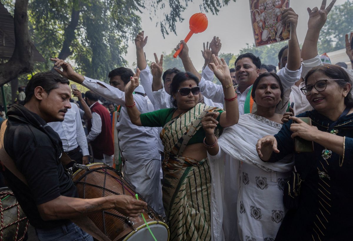  Supporters of India's main opposition Congress party celebrate after the initial poll results in Karnataka elections