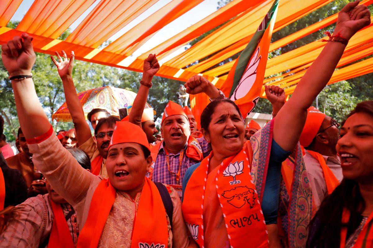 Supporters of India's ruling Bharatiya Janata Party celebrate initial poll results of Gujarat state assembly election.