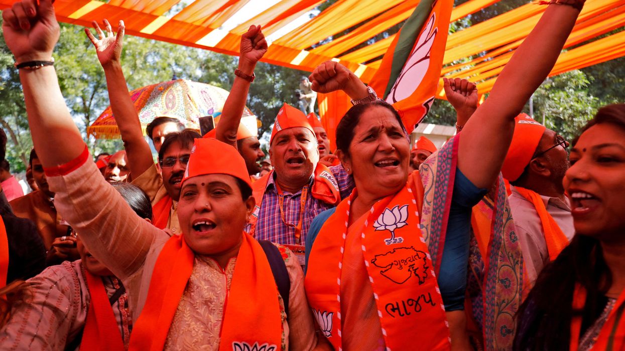 Supporters of India's ruling Bharatiya Janata Party celebrate initial poll results of Gujarat state assembly election.