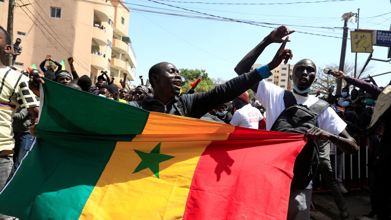 Supporters of opposition leader Ousmane Sonko, who was indicted and released on bail under judicial supervision, attend a demonstration in front of the court in Dakar, Senegal March 8, 2021