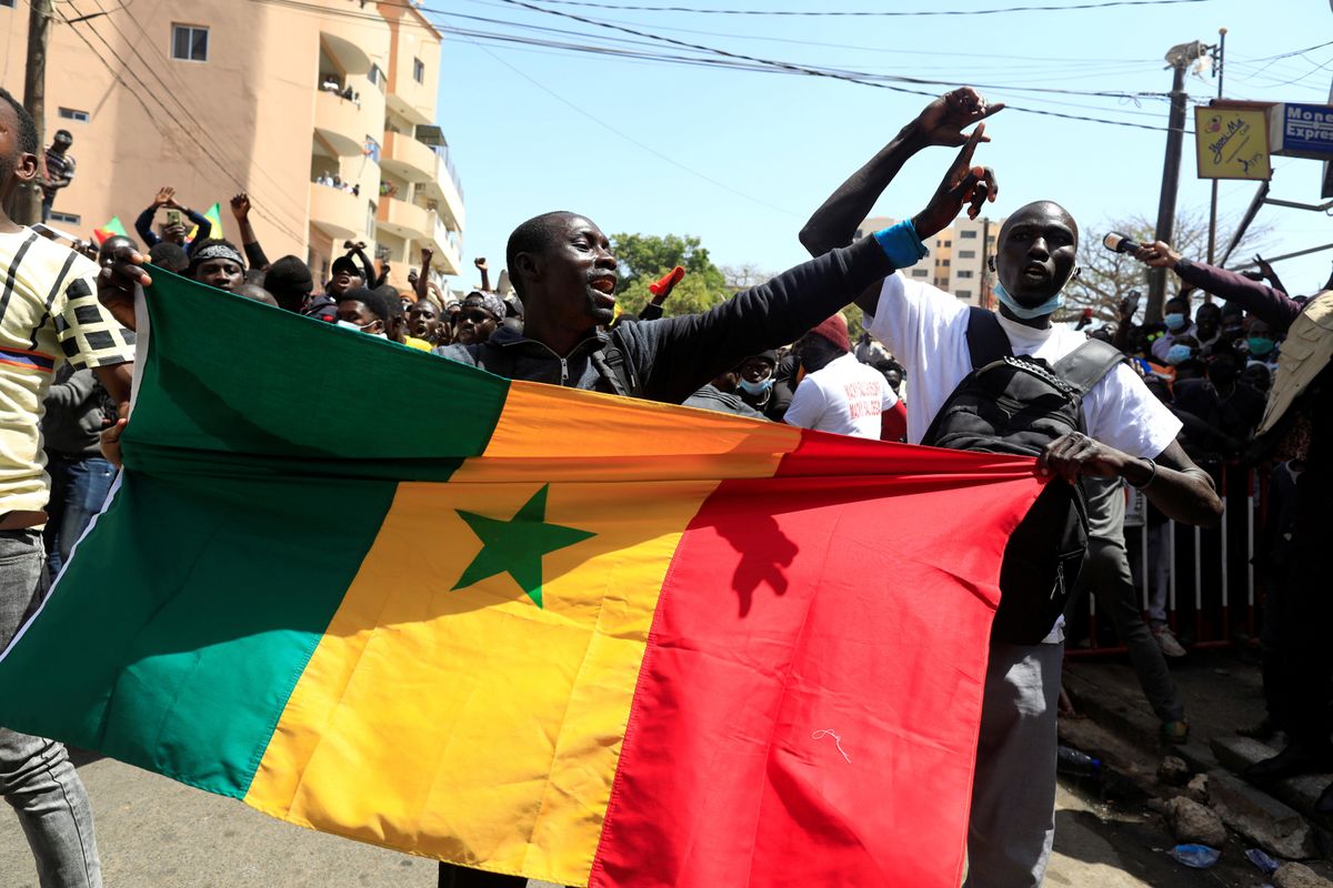 Supporters of opposition leader Ousmane Sonko, who was indicted and released on bail under judicial supervision, attend a demonstration in front of the court in Dakar, Senegal March 8, 2021