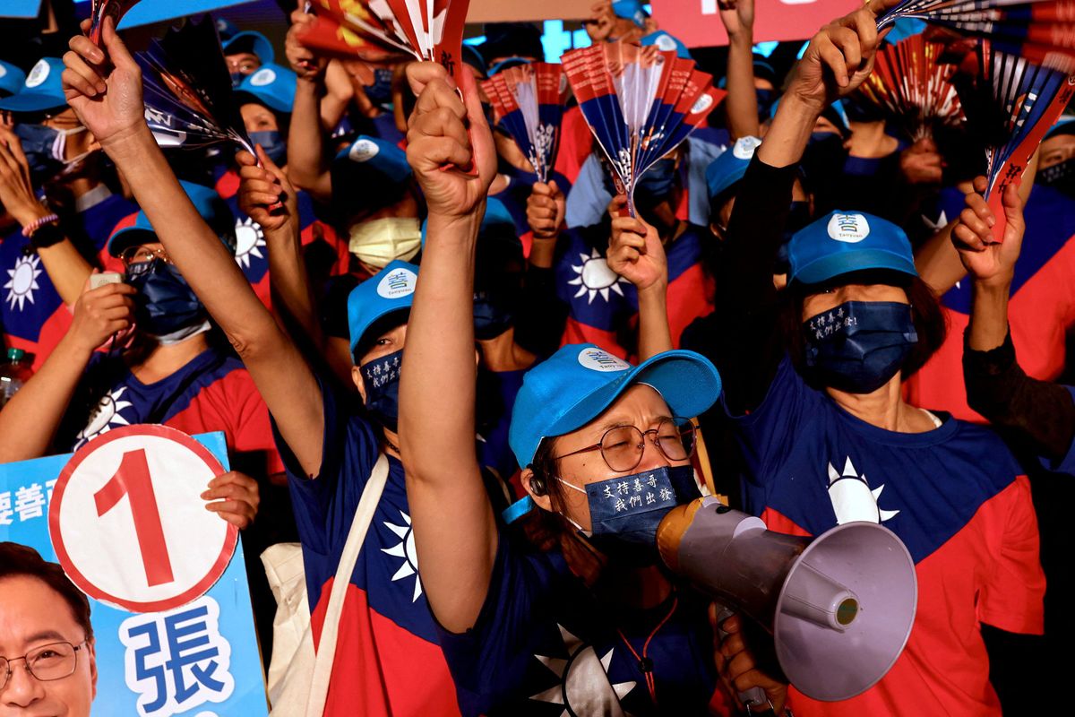 Supporters of opposition party KMT wearing t-shirts with the Taiwan flag at an election rally in Taoyuan.