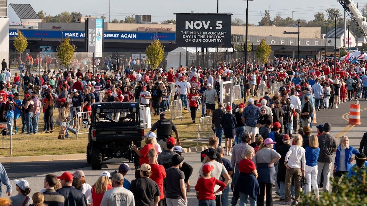 Supporters of Republican presidential nominee and former U.S. President Donald Trump wait in line to attend a campaign rally in Macon, Georgia U.S., November 3, 2024.