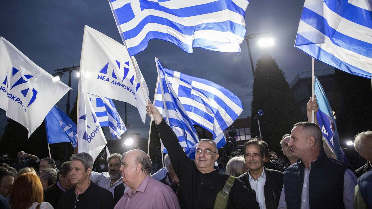 Supporters of the conservative New Democracy party celebrate their election victory in Athens.