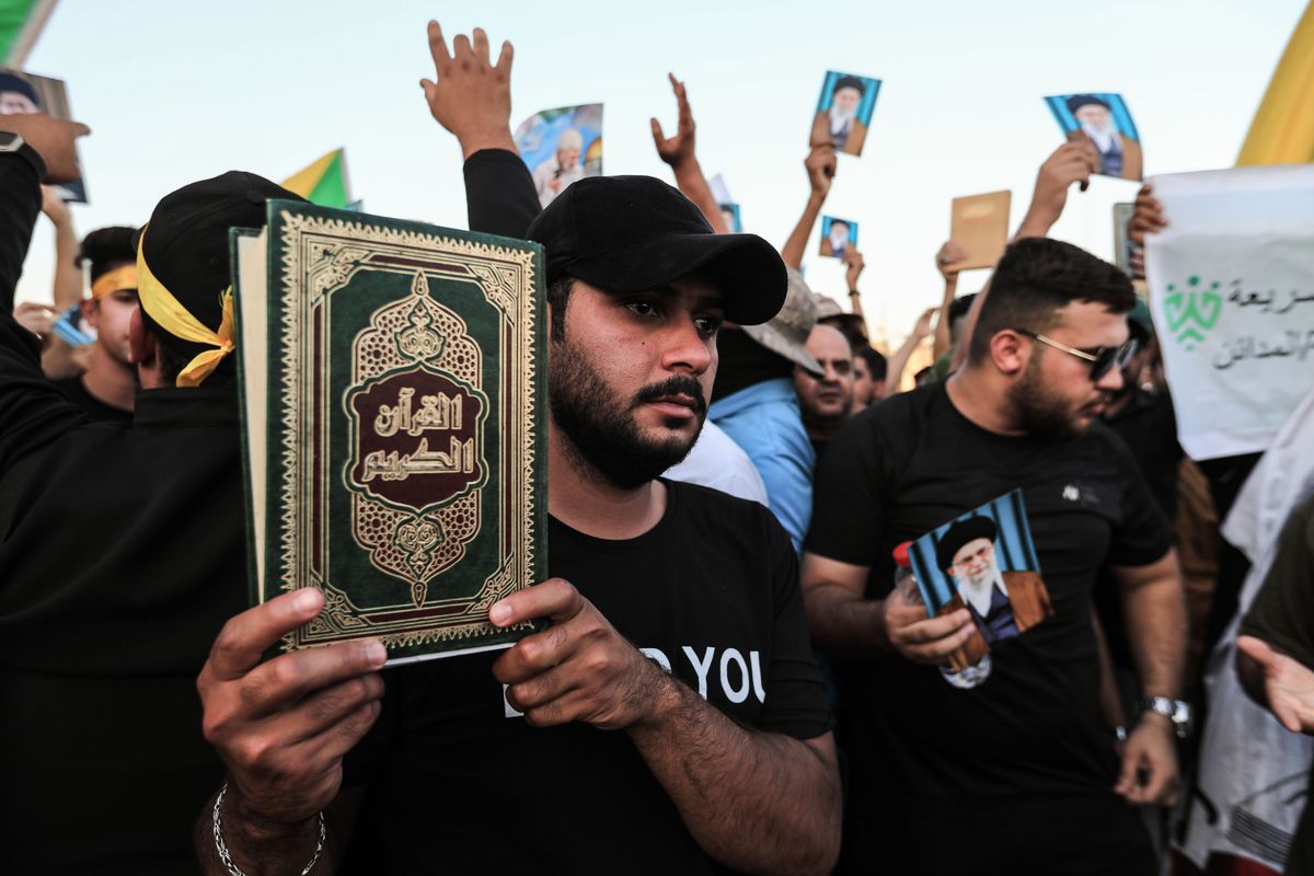 Supporters of the Popular Mobilization Forces protest in Tahrir Square in Baghdad to denounce the burning of the Quran and the Iraqi flag in Stockholm.