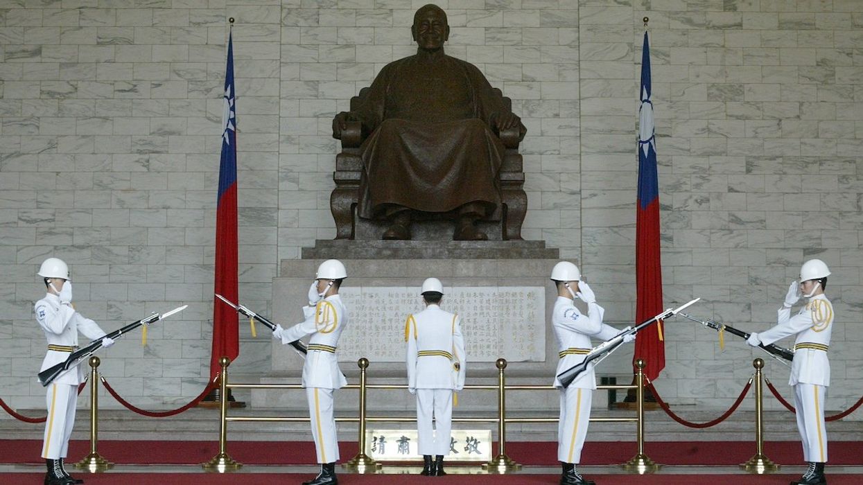 Taiwan honour guards march in front of a statue of Chinese Nationalist Generalissimo Chiang Kai-shek at a changing of the guards ceremony on October 27, 2003. Chiang's widow, Soong May-ling, died aged 106 in New York last week. Family members are considering whether to bury the former first lady in the United States, Taiwan or China.