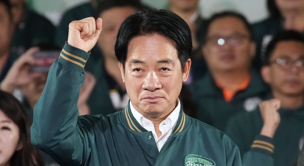 ​Taiwan's Vice President Lai Ching-te, who heads the ruling Democratic Progressive Party, raises his fist after winning the presidential election in Taipei on Jan. 13, 2024.