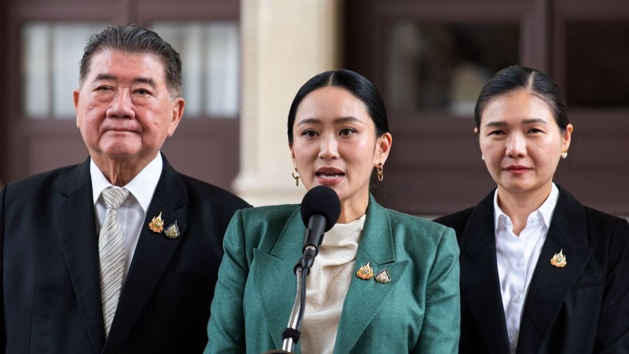 Thai Prime Minister Paetongtarn Shinawatra (C) speaks to the media during a press conference after the Constitutional Court suspends her from duty at Government House.
