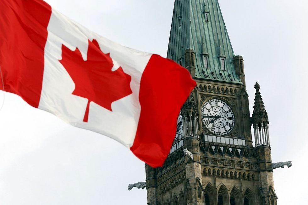 The Canadian flag flies on Parliament Hill in Ottawa August 2, 2015.