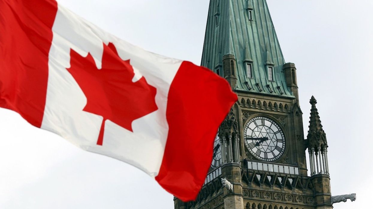 The Canadian flag flies on Parliament Hill in Ottawa.