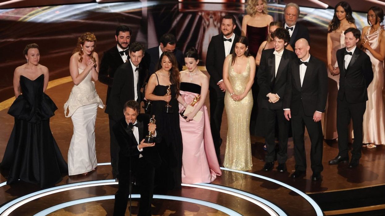 The cast, crew, director and producers of "Anora" celebrate their best picture win.