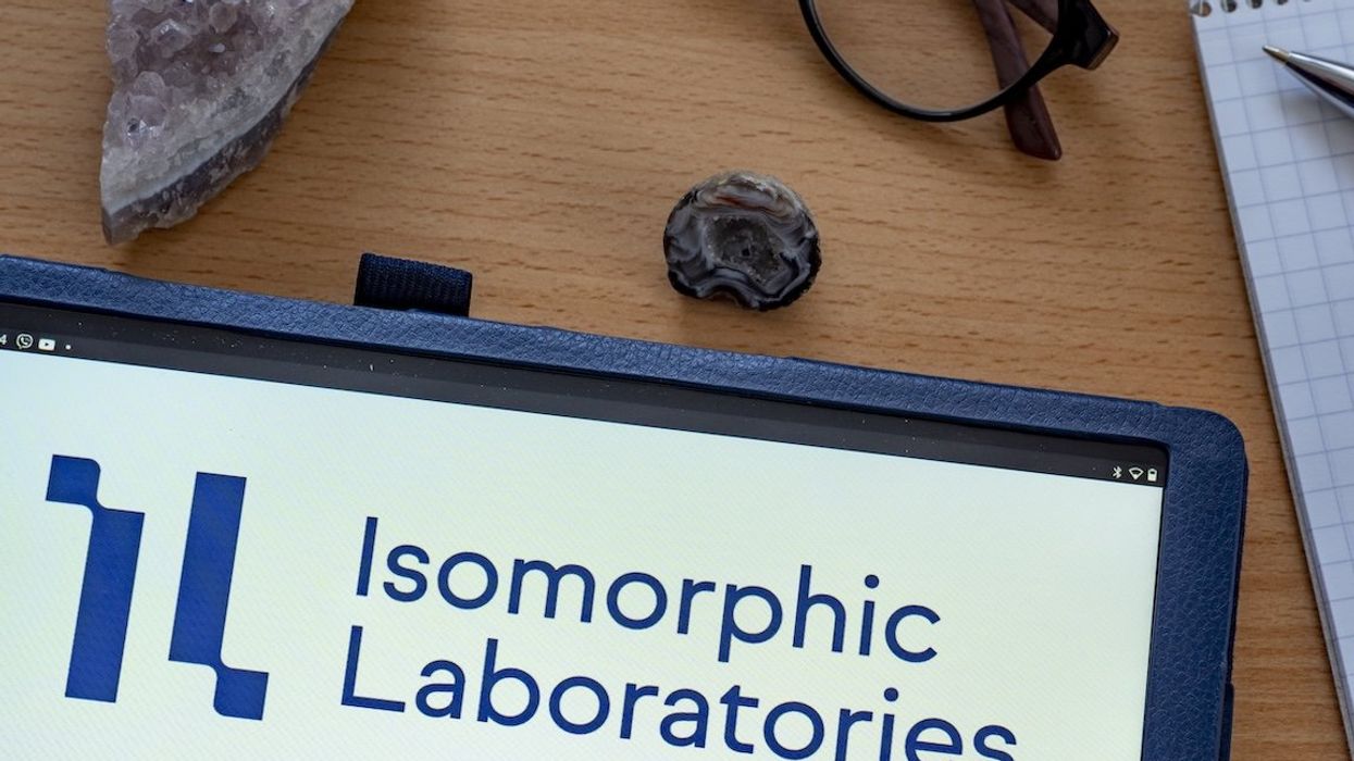The logo for Isomorphic Labs is displayed on a tablet in this illustration.